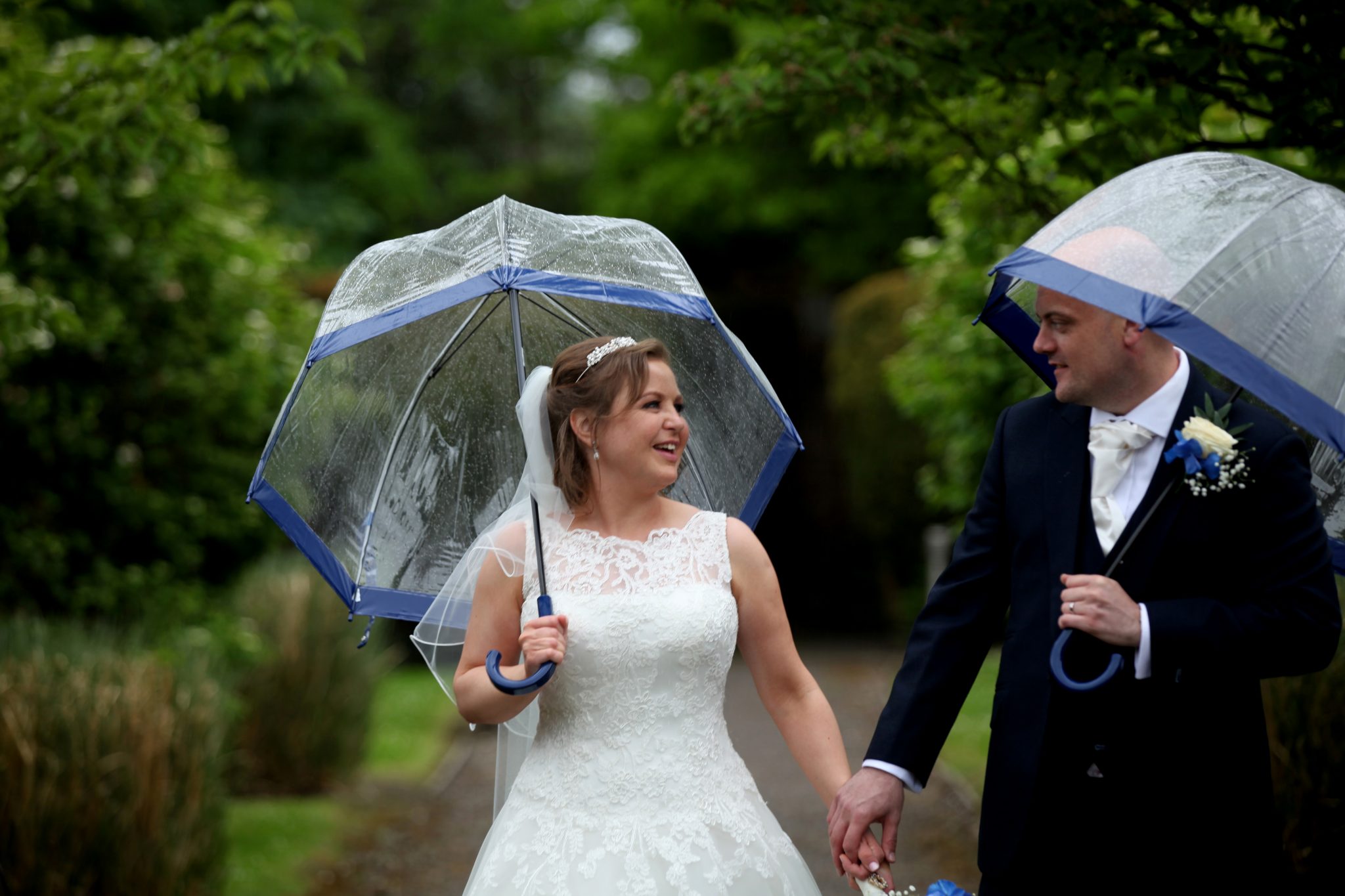 Bride and Groom in rain at Latimer Place