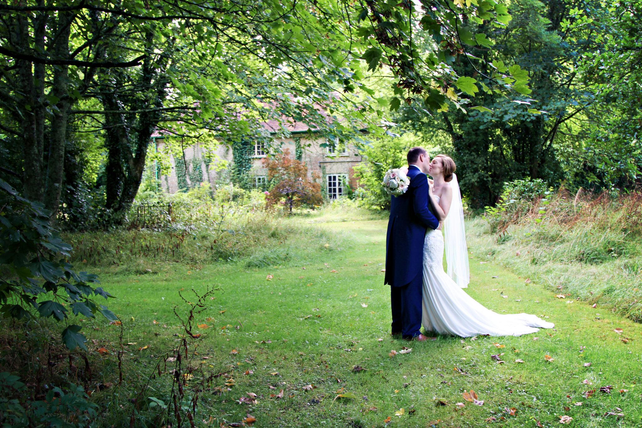 Bride and Groom in grounds at Eastclose Hotel, Hampshire.